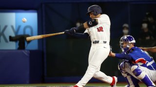 Jamie Westbrook #12 of Team United States hits a solo home run in the fourth inning against Team Republic of Korea during the semifinals of the men's baseball on day thirteen of the Tokyo 2020 Olympic Games at Yokohama Baseball Stadium on August 05, 2021 in Yokohama, Japan.