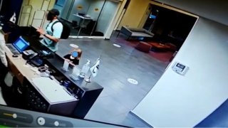 The suspect and his child captured by security cameras at a hotel near Rosarito, Mexico.