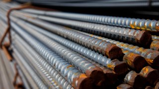 Bundles of steel from Nucor Corp. sit for sale to at Thompson Building Materials in Lomita, California, U.S., on Thursday, Aug. 30, 2012.