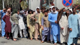 Afghans line up outside a bank to take out their money after Taliban takeover in Kabul, Afghanistan September 1, 2021.