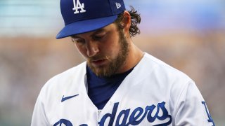 Trevor Bauer #27 of the Los Angeles Dodgers returns to the dugout after the top of the first inning against the San Francisco Giants at Dodger Stadium on June 28, 2021 in Los Angeles, California.