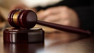 A gavel rests on a table