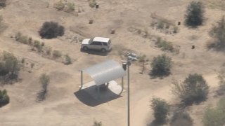 A driver speeds through a recreation center field.