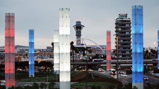 The pylons are lit up in red, white and blue for Labor Day at LAX.