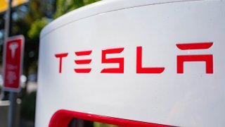 Close up of Tesla logo on a charger at a Supercharger rapid battery charging station for the electric vehicle company Tesla Motors, in the Silicon Valley town of Mountain View, California, August 24, 2016.