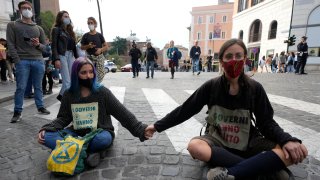 Activists from Extinction Rebellion block a road