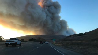 Wildfire smoke fills the sky over the 101 Freeway in Santa Barbara.