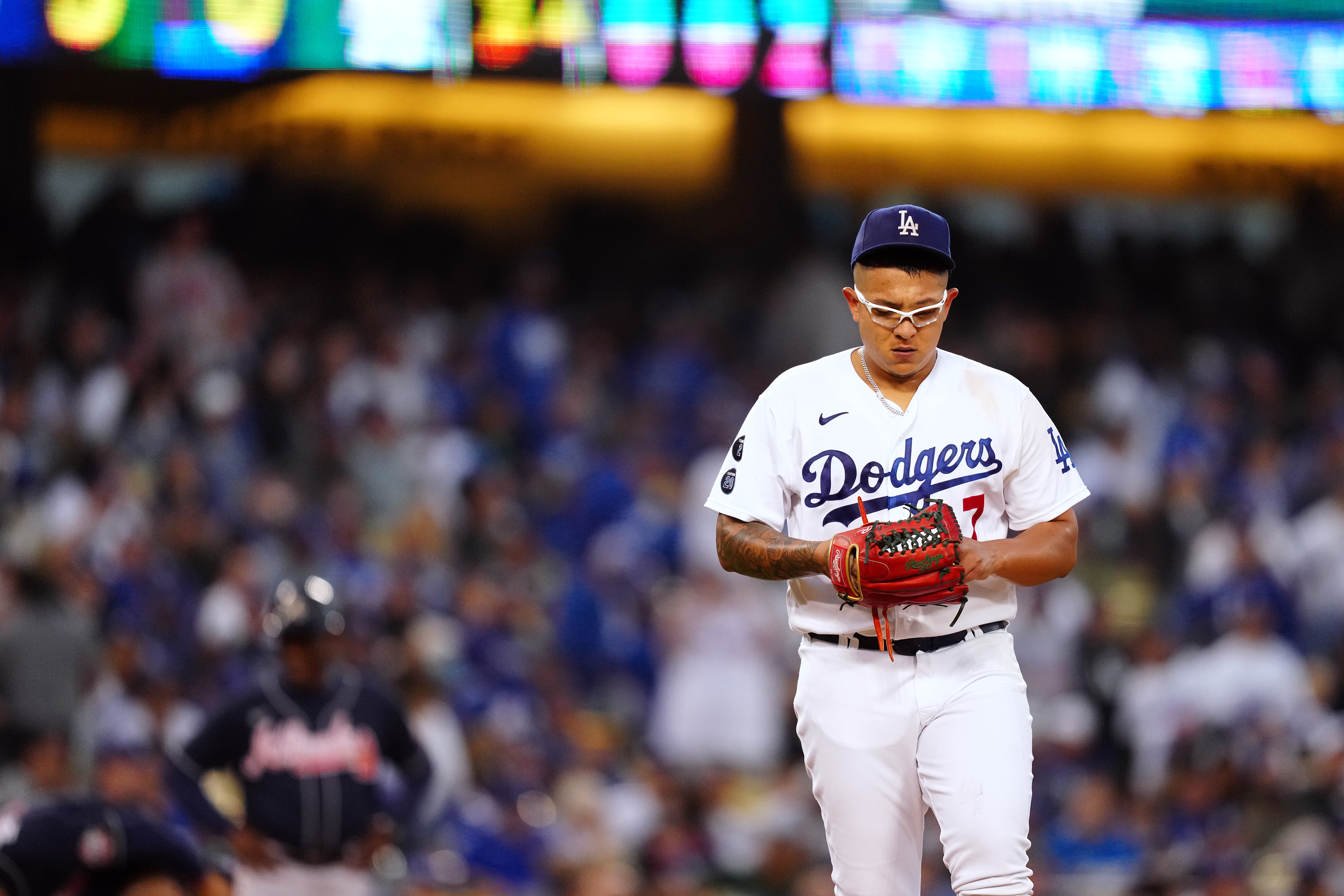 Dodger pitcher Julio Urias reacts as he meets Miles Urias, a young