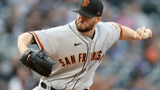 Starting pitcher Alex Wood #57 of the San Francisco Giants throws against the Colorado Rockies in the first inning at Coors Field on September 24, 2021 in Denver, Colorado.