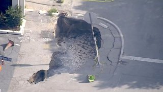 A sink hole opened in a Boyle Heights parking lot.