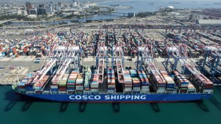 Aerial view of a container ship of COSCO shipping unloading cargoes at the Port of Los Angeles on October 26, 2021 in San Pedro, California.