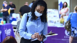 A woman seeking employment attends the 25th annual Central Florida Employment Council Job Fair at the Central Florida Fairgrounds.