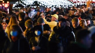 Visitors at the Christmas market in Dortmund, western Germany on November 22, 2021. Some of Germany’s federal states have canceled their Christmas markets due to the Covid crisis.