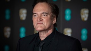 Director Quentin Tarantino poses for photographers upon arrival at the BAFTA awards in London, Sunday, Feb. 2, 2020.