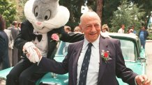 Mel Blanc poses with Bugs Bunny at his 80th birthday party in Los Angeles, June 2, 1988.