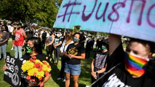 People are seen at a protest.