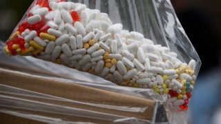 A bag of assorted pills and prescription drugs dropped off for disposal is displayed during the Drug Enforcement Administration (DEA) 20th National Prescription Drug Take Back Day at Watts Healthcare on April 24, 2021 in Los Angeles, California. – According to the Centers for Disease Control and Prevention, the US has seen an increase in drug overdose deaths during the Covid-19 pandemic, accelerating significantly during the first months of the public health emergency, including deaths from opioids and counterfeit pills containing fentanyl. (Photo by Patrick T. FALLON / AFP) (Photo by PATRICK T. FALLON/AFP via Getty Images)