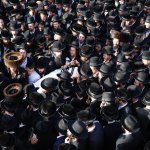 Mourners carry the body of Shragee Gestetner, a Canadian singer who died during Lag BaOmer celebrations at Mt. Meron in northern Israel, at his funeral in Jerusalem, April 30, 2021. A stampede at a religious festival attended by tens of thousands of ultra-Orthodox Jews in northern Israel killed dozens of people and injured about 150 others early Friday, medical officials said. It was one of the country's deadliest civilian disasters.