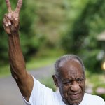 Bill Cosby flashes a victory sign outside his home, June 30, 2021, in Elkins Park, Pennsylvania, after being released from prison. Cosbys sexual assault conviction was tossed after the state's highest court ruled that a former agreement to not bring charges against Cosby on Andrea Constand's behalf was ignored by prosecutors.