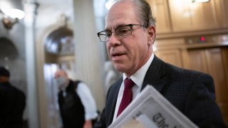 Sen. Mike Braun, R-Ind., arrives to vote on an appropriations bill that funds the government through Feb. 18 and avoids a short-term shutdown after midnight Friday, at the Capitol in Washington, Thursday, Dec. 2, 2021.