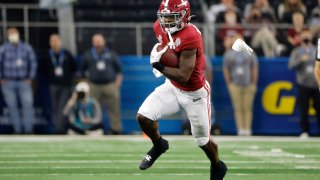 Alabama running back Brian Robinson Jr. (4) runs for a gain against Cincinnati during the first half of the Cotton Bowl NCAA College Football Playoff semifinal game, Friday, Dec. 31, 2021, in Arlington, Texas.