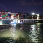 Rescue ships work at the site of the stuck container ship Ever Given on the Suez Canal, Egypt, March 27, 2021. At least 321 vessels were jammed around the Suez Canal awaiting salvage of the giant container ship that has been stuck and blocking the vital waterway.