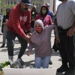 Family members of Amarjeet Johal, who was killed in a mass shooting, attend a vigil in Indianapolis, Indiana on April 18, 2021, to remember the victims of a mass shooting at a local FedEx facility which took the lives of eight people.