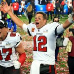 Rob Gronkowski #87 and Tom Brady #12 of the Tampa Bay Buccaneers celebrate after defeating the Kansas City Chiefs in Super Bowl LV at Raymond James Stadium, Feb. 7, 2021 in Tampa, Florida. The Buccaneers defeated the Chiefs 31-9.