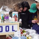 A memorial outside of Oxford High School continues to grow on Dec. 3 2021 in Oxford, Michigan. Four students were killed and seven others injured on November 30, when a student opened fire with a pistol at the school. Both the gunman and his parents were arrested and charged for the shooting.