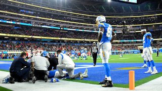 Medical staff respond to Donald Parham during Thursday's game.