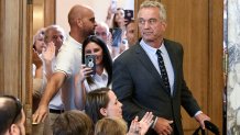 FILE - Robert F. Kennedy, Jr. arrives for a hearing about whether stricter vaccine requirements were constitutional at the Albany County Courthouse Wednesday, Aug. 14, 2019, in Albany, N.Y. Kennedy has been a key part of the anti-vaccine movement for years, but doctors and public health advocates told the AP that COVID-19 launched him to a new level. (AP Photo/Hans Pennink, File)