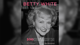 This cover image released by becker&mayer! shows "Betty White: 100 Remarkable Moments in an Extraordinary Life."