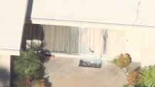 A sliding glass door was shattered in a home invasion and shooting at a Beverly Hills home.