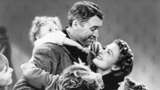 This image released by Paramount Home Entertainment shows child actor Karolyn Grimes on the back of Jimmy Stewart in a scene from the holiday classic "It's a Wonderful Life."