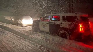 A storm closes part of Interstate 80 in the Sierra Nevada Mountains.