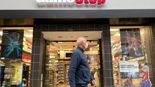A mall visitor walks be a GameStop store on December 08, 2021 in San Rafael, California.