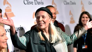 FILE – Joni Mitchell arrives at the 2015 Clive Davis Pre-Grammy Gala in Beverly Hills, Calif. Feb. 7, 2015.