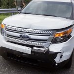 This July 29, 2016 photo provided by Celeste Norris, shows Ashli Babbitt's damaged vehicle after a road rage incident where Babbitt, who then had the last name McEntee, rammed the back of Norris' SUV three times as part of a fight over an extramarital affair. Babbitt was later charged with numerous misdemeanors.