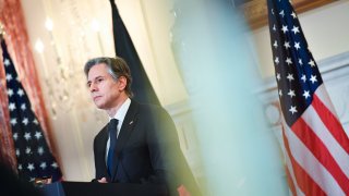 Secretary of State Antony Blinken listens during a news conference with German Foreign Minister Annalena Baerbock at the State Department, Wednesday, Jan. 5, 2022, in Washington.