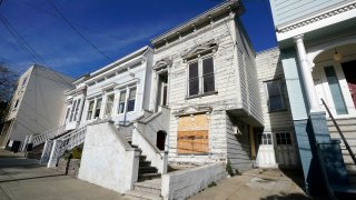 A recently sold Victorian home is shown in San Francisco, Friday, Jan. 14, 2022. The decaying, 122-year-old Victorian marketed as "the worst house on the best block" of San Francisco recently sold for nearly $2 million — an eye-catching price that the realtor said was the outcome of overbidding in an auction.