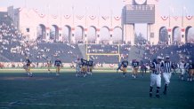 LOS ANGELES, CA - JANUARY 15, 1967:  The members of the Green Bay Packers and the Kansas City Chiefs walk off the field at the conclusion of Super Bowl I on January 15, 1967 at the Los Angeles Memorial Coliseum in Los Angeles, California.  The Packers beat the Chiefs, 35-10 to win the professional football World Championship.
19670115-FR-348
1967 Kidwiler Collection/Diamond Images