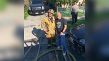 Pasadena Fire Capt. William Basulto (right) is pictured at the scene of a fire Sunday Jan. 30, 2022 in East LA.