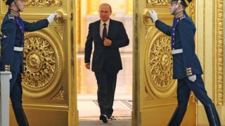 Russian President Vladimir Putin enters the St. George Hall at the Grand Kremlin Palace in Moscow.