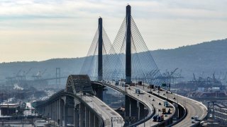 The old Gerald Desmond Bridge sits waiting to be torn down next to the new bridge.