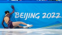 Zhu Yi, of China, falls in the women's short program team figure skating competition at the 2022 Winter Olympics, Sunday, Feb. 6, 2022, in Beijing. (AP Photo/Natacha Pisarenko)