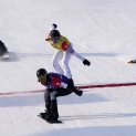United States' Lindsey Jacobellis (5) reacts as she crosses the finish line followed by France's Chloe Trespeuch (8), United States' Stacy Gaskill (4), and Italy's Michela Moioli (1) during the Women's Cross Finals at the 2022 Winter Olympics, Feb. 9, 2022, in Zhangjiakou, China.