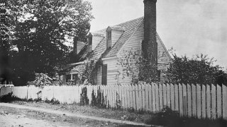 This early 1900s photo provided by the The Colonial Williamsburg Foundation shows the front of the Dudley Digges House in its original location on Prince George Street, in Williamsburg, Va