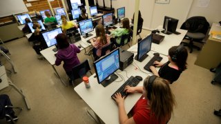 students work at their computers