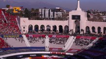 Los Angeles, CA - February 06: With a view of the snow-capped mountains in the background, NASCAR racers circle the quarter-mile track during the Busch Light Clash At The Coliseum, a NASCAR exhibition race at the historic LA Memorial Coliseum in Los Angeles Sunday, Feb. 6, 2022. Joey Logano, #22, went on to win the race. The season-opening Clash exhibition race gets a taste of West Coast flavor in 2022, marking a historic first visit to the tradition-rich Los Angeles Memorial Coliseum. The event is to be contested around a quarter-mile asphalt oval that will be built around the facilitys football field. The Los Angeles event marks the first time the preseason Clash is held outside of Daytona International Speedway since its inception in 1979, and gives the sport its first competitive look at the Next Gen car on Feb. 6 in a non-points event, including a pre-race concert by Pit Bull and Ice Cube. (Allen J. Schaben / Los Angeles Times via Getty Images)