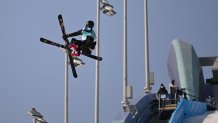 Norway's Birk Ruud carries a Norwegian flag during his final run during the Freestyle Skiing Men's Big Air final during the 2022 Winter Olympics at the Big Air Shougang in Beijing, China on Feb. 9, 2022. Ruud won gold in the event.